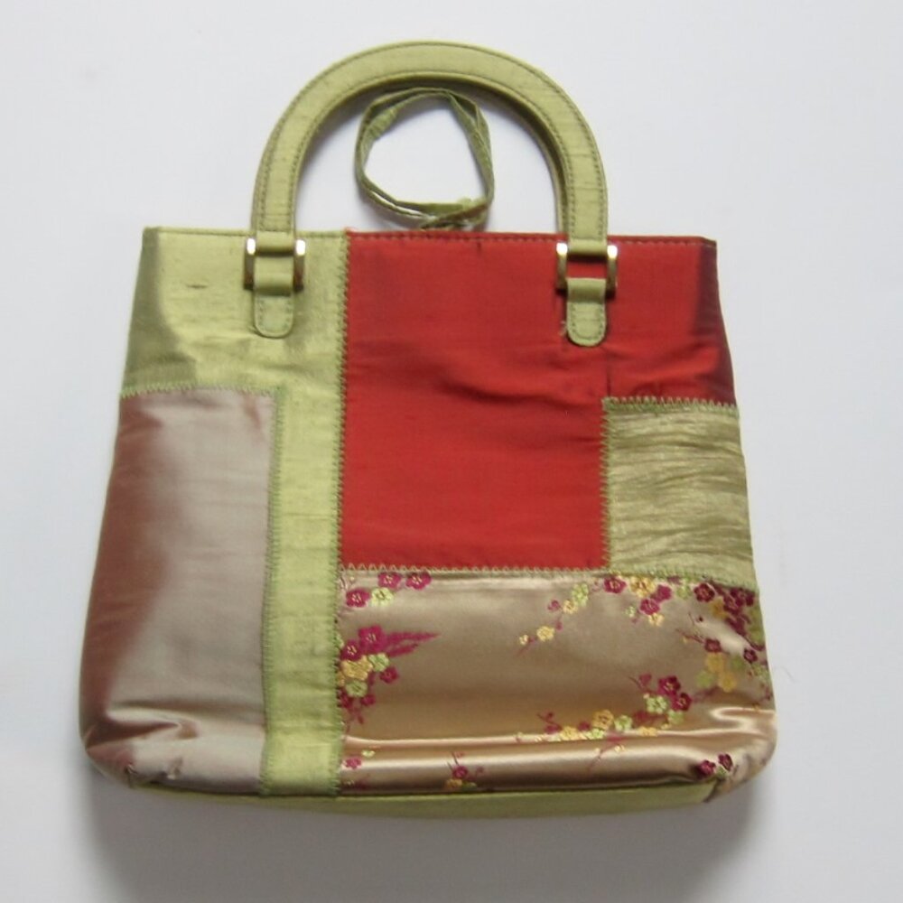 This silky muti-colored bag has floral design.
